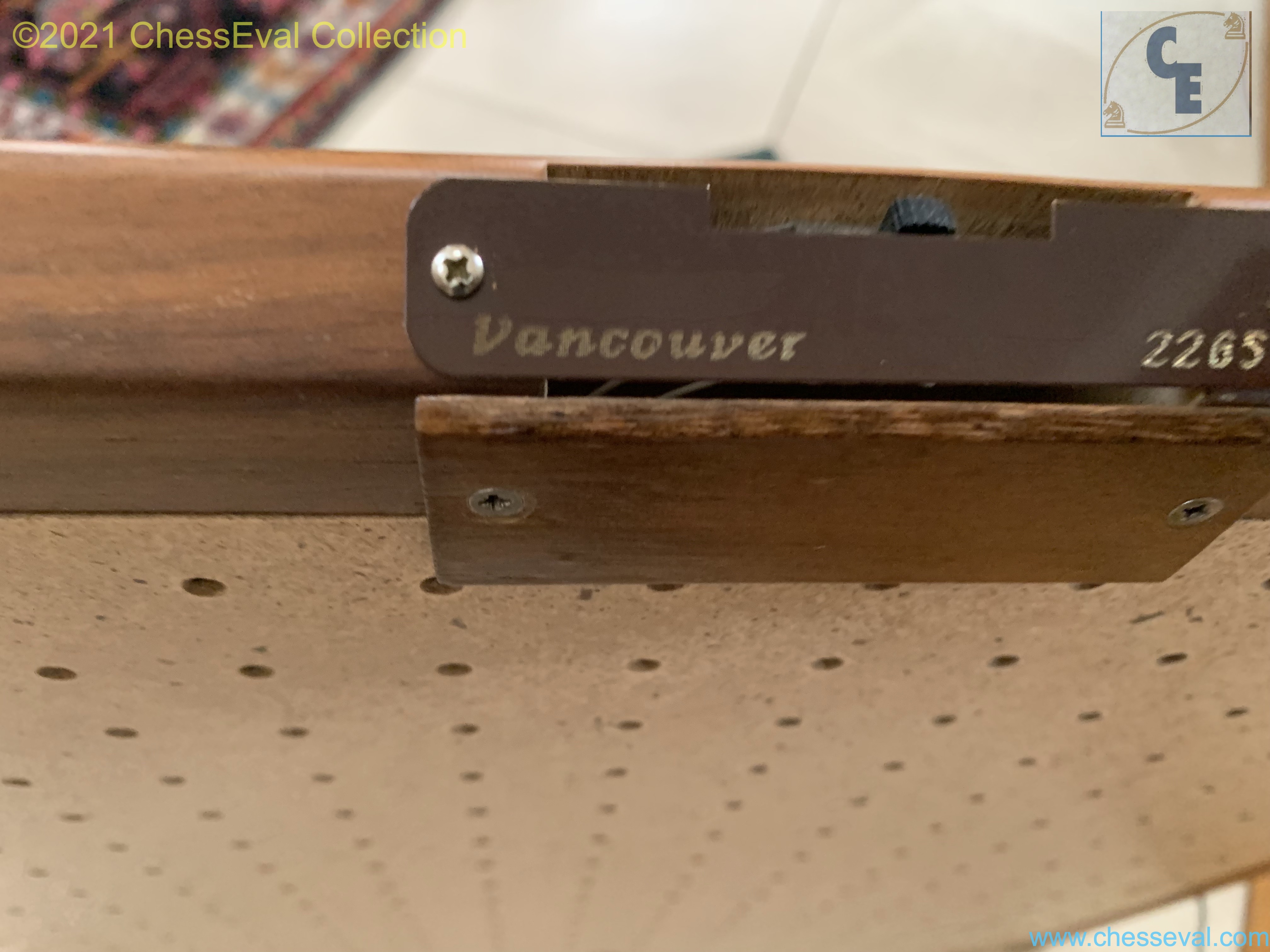 Close-up of the Vancouver add-on fitted beneath the board in the Elite Premiere record.