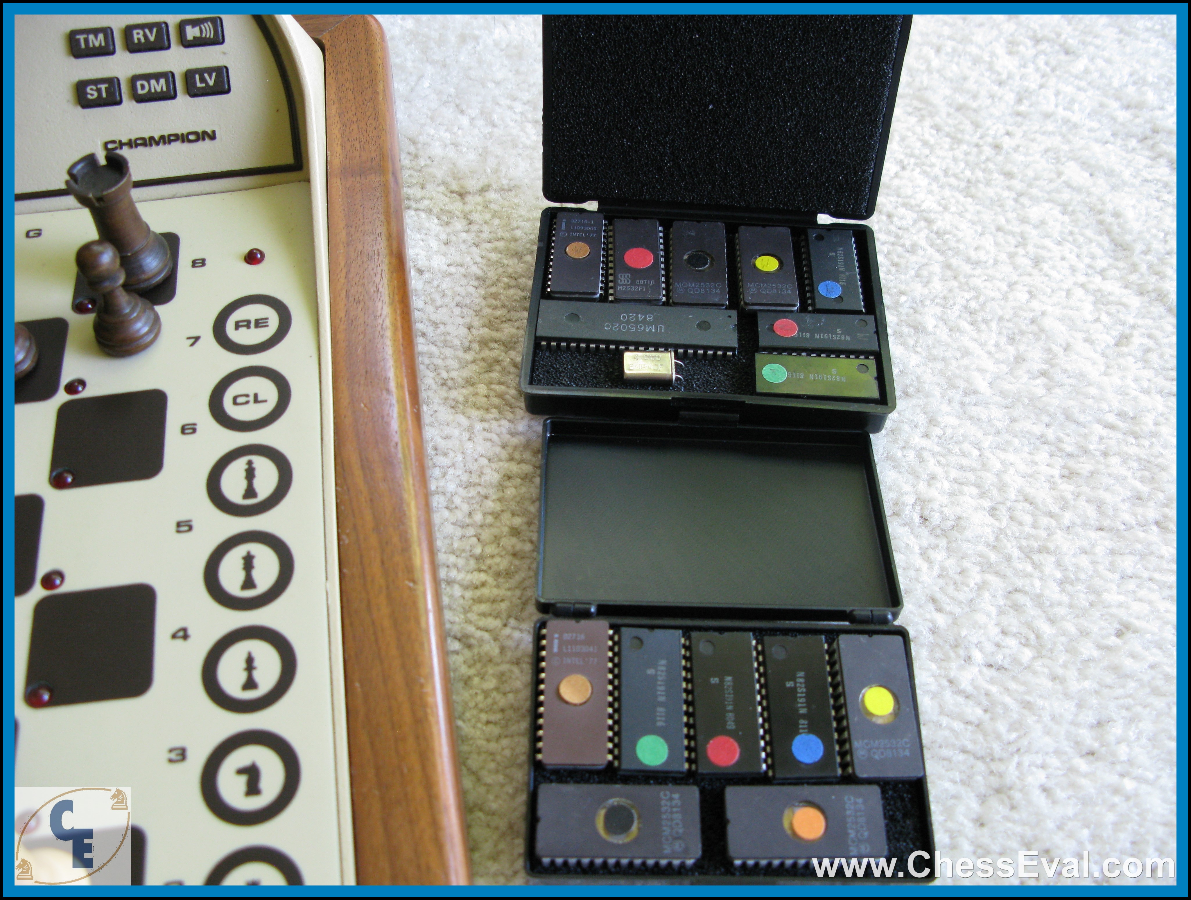 EPROM chips in open protective cases beside the Elite Champion control panel.